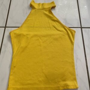 yellow open back top sleeve less size M
